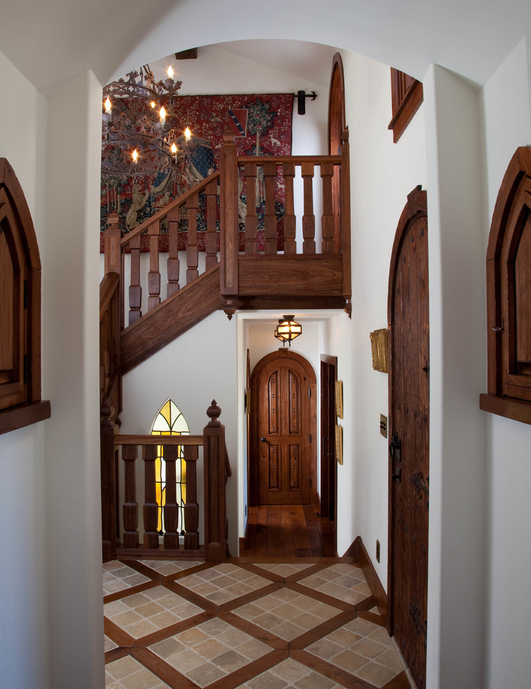 Elegant wood railing staircase photo in San Diego