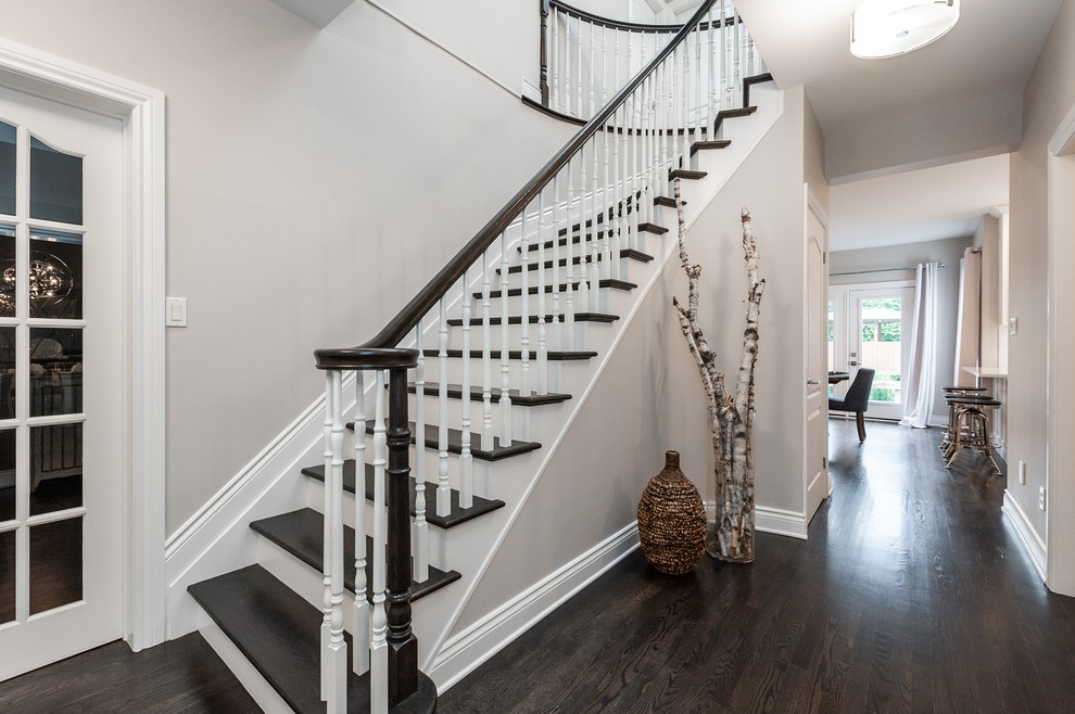 Design ideas for a medium sized contemporary wood curved wood railing staircase in Ottawa with wood risers.