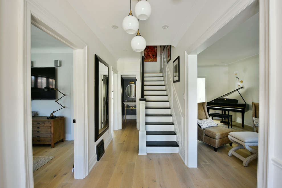 Mid-sized transitional wooden straight staircase photo in Toronto with wooden risers