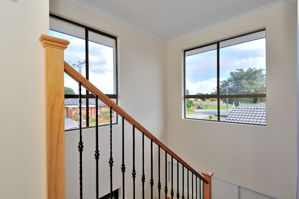 Small contemporary wood l-shaped metal railing staircase in Perth with wood risers.