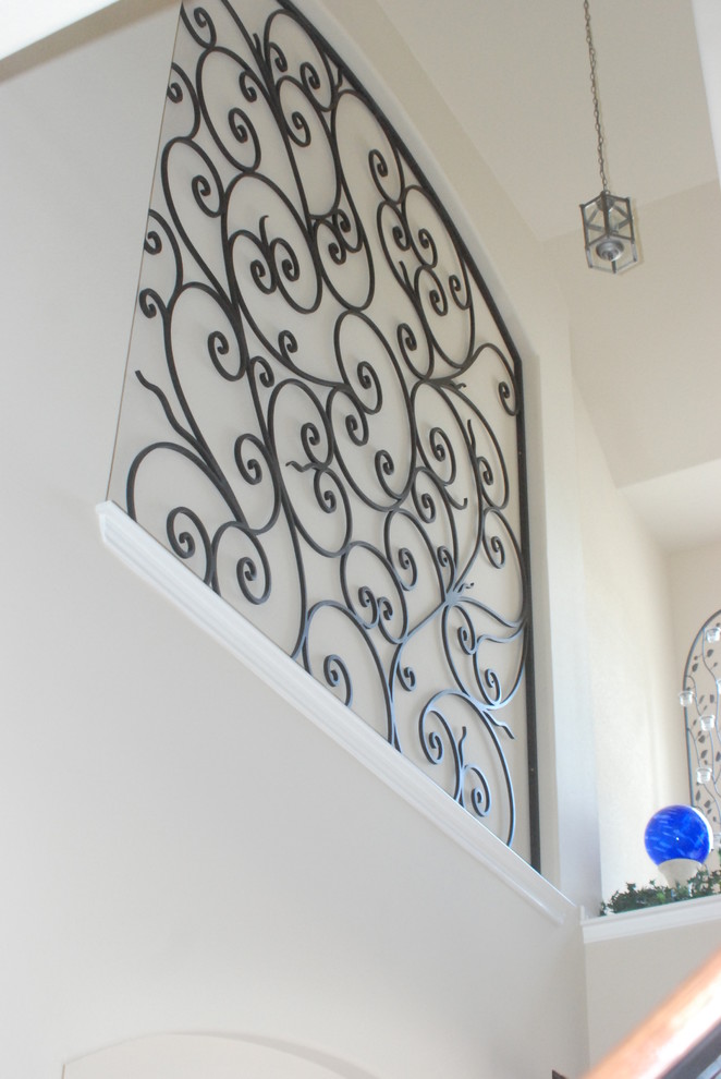 Inspiration for a mid-sized mediterranean straight metal railing staircase remodel in Houston