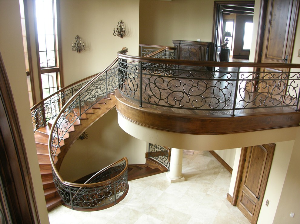 Inspiration for a huge timeless wooden curved staircase remodel in Portland with wooden risers