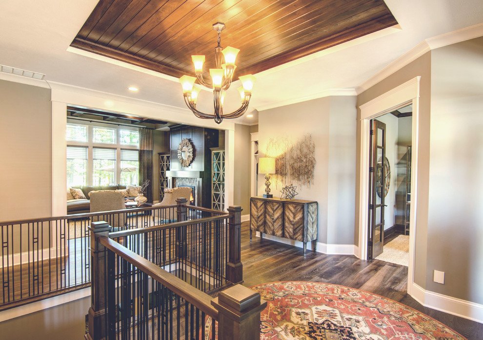 Example of a mid-sized arts and crafts wooden metal railing staircase design in Indianapolis