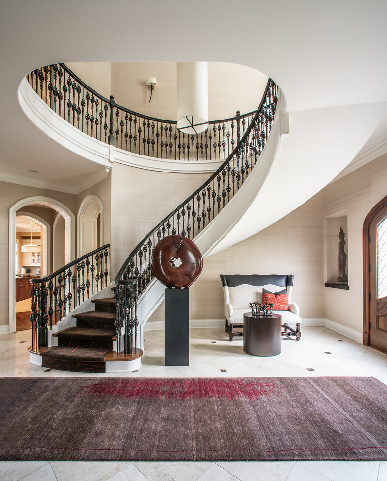 Photo of a large traditional carpeted curved staircase in Chicago with carpeted risers.