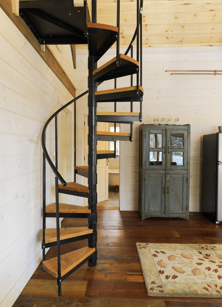 This is an example of a rustic spiral staircase in Burlington.