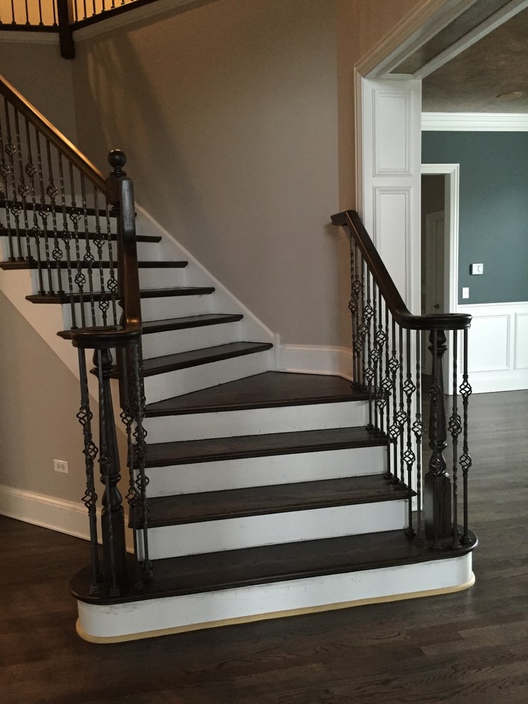 Example of a mid-sized trendy wooden curved wood railing staircase design in Chicago with painted risers