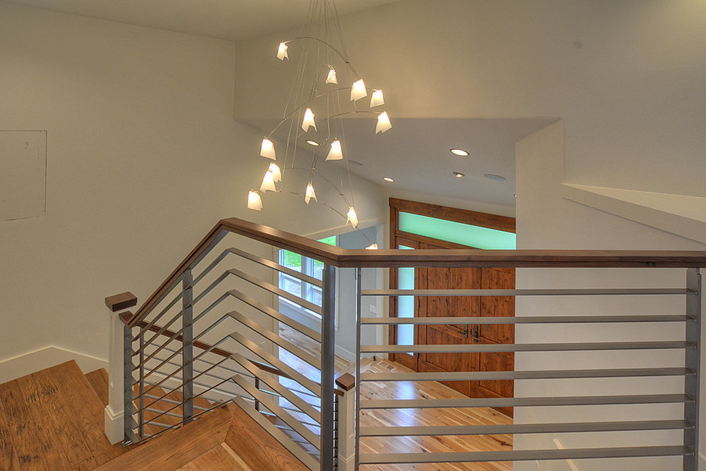 Mid-sized trendy wooden l-shaped mixed material railing staircase photo in Seattle with painted risers