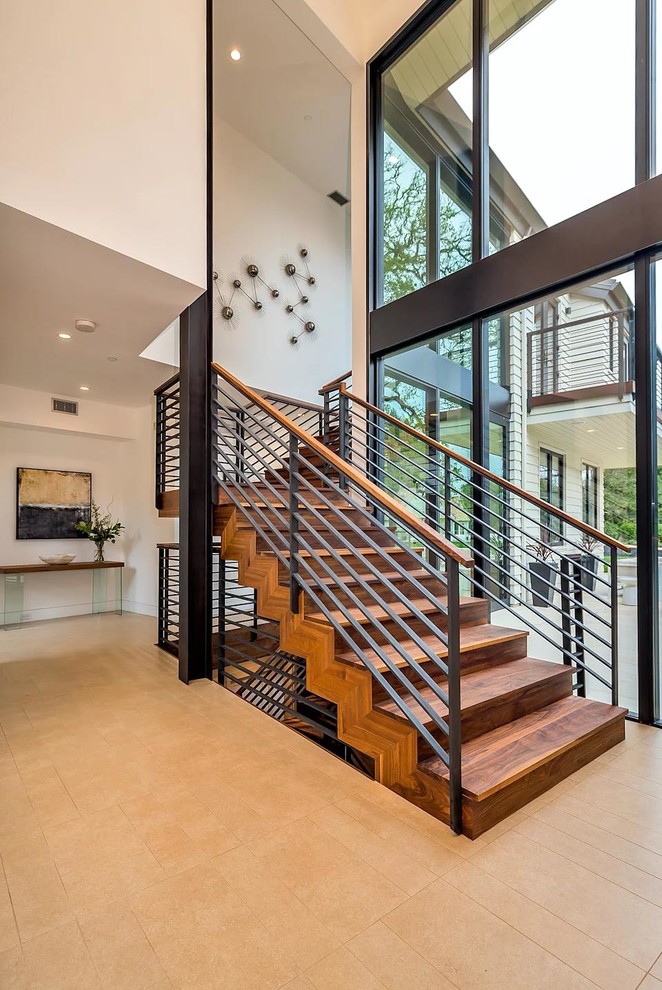 Свежая идея для дизайна: деревянная лестница на больцах, среднего размера в стиле модернизм с деревянными ступенями и деревянными перилами - отличное фото интерьера