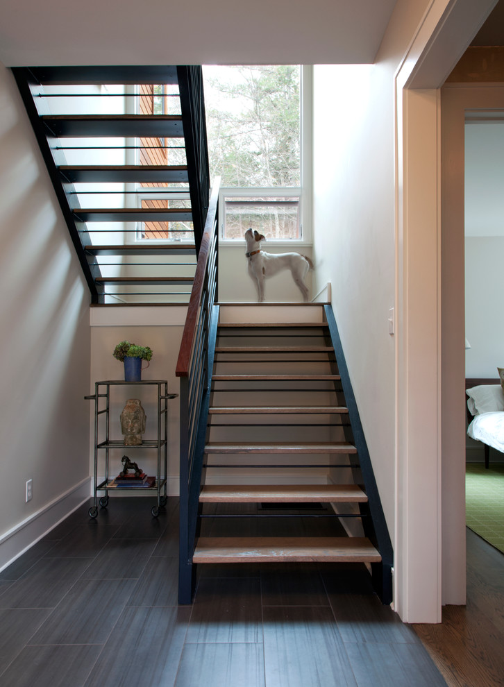Idée de décoration pour un escalier sans contremarche design avec palier.