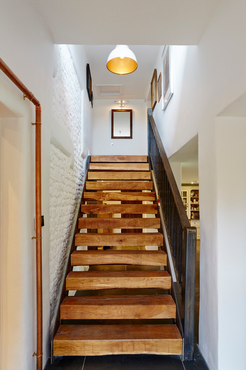A stylish hall and staircase with reclaimed oak railway sleepers