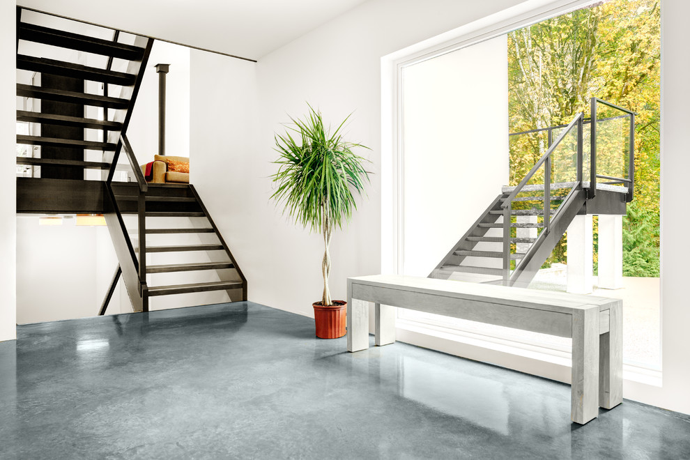 This is an example of a modern wood staircase in Vancouver with open risers.