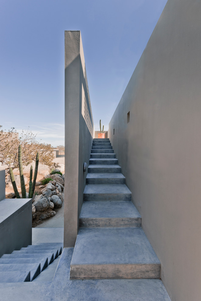 Exemple d'un escalier moderne en béton avec des contremarches en béton et palier.