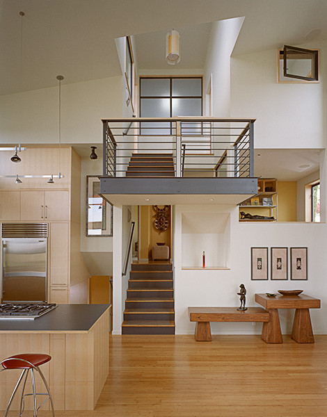 This is an example of a modern staircase in Seattle with feature lighting.