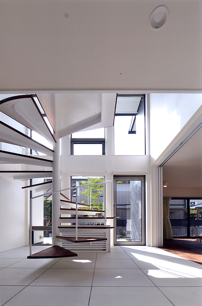 Design ideas for a contemporary spiral staircase in Other with open risers.