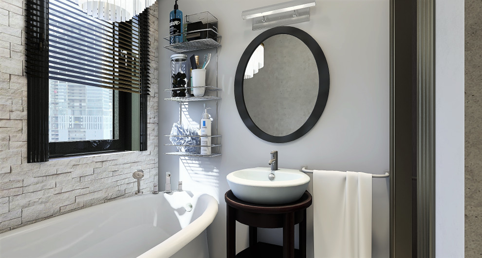 Kleines Retro Badezimmer En Suite mit dunklen Holzschränken, Löwenfuß-Badewanne, grauer Wandfarbe, Aufsatzwaschbecken, Einzelwaschbecken, freistehendem Waschtisch und Ziegelwänden in Mailand
