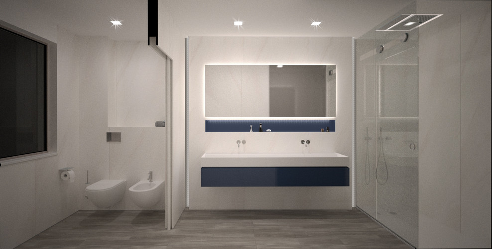 This is an example of a large modern family bathroom in Rome with flat-panel cabinets, blue cabinets, an alcove bath, an alcove shower, a wall mounted toilet, white tiles, porcelain tiles, white walls, light hardwood flooring, a console sink, solid surface worktops, a sliding door and white worktops.