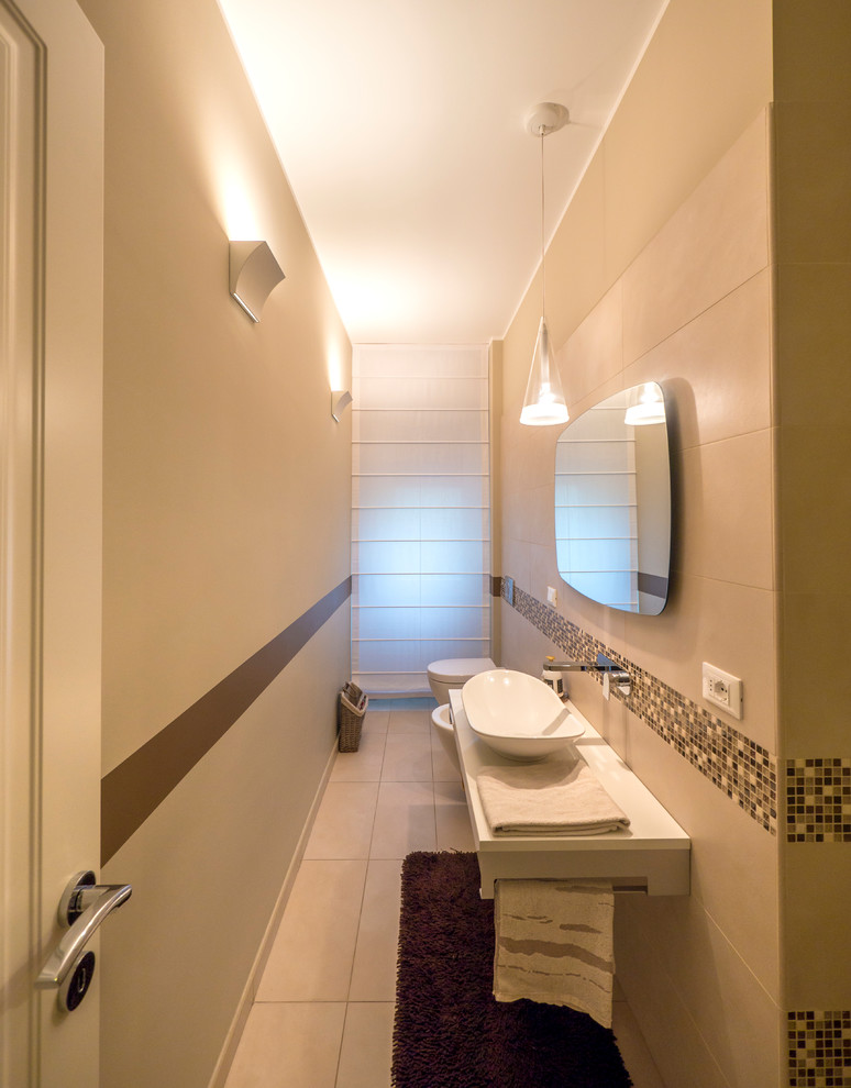 Example of a small trendy master beige tile and porcelain tile porcelain tile alcove bathtub design in Milan with a wall-mount toilet, beige walls, a vessel sink and quartzite countertops