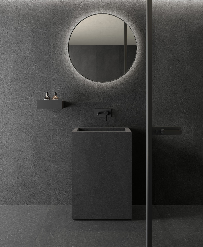 На фото: ванная комната в современном стиле с черными фасадами, черной плиткой, керамогранитной плиткой, черными стенами, полом из керамогранита, черным полом, тумбой под одну раковину и напольной тумбой с