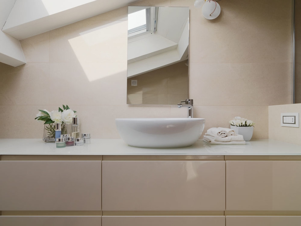 Inspiration for a contemporary bathroom remodel in Milan with flat-panel cabinets and a vessel sink