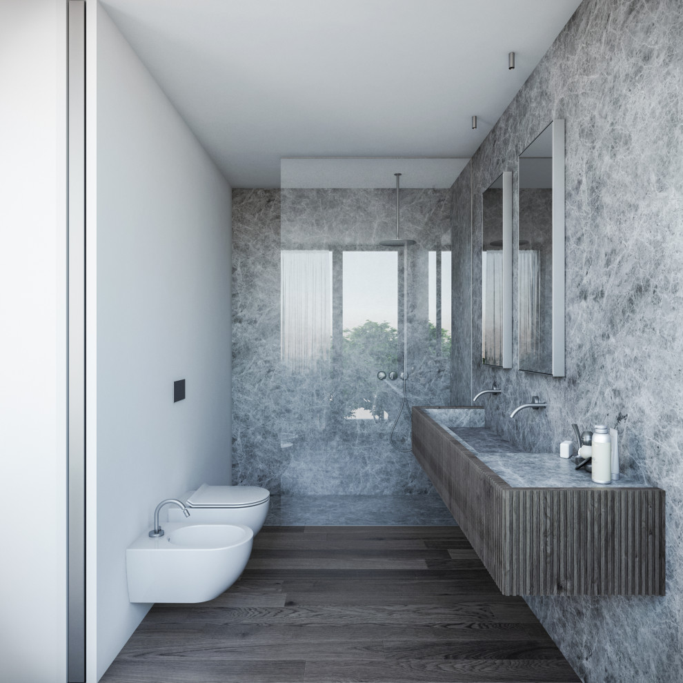 Idéer för att renovera ett mellanstort funkis en-suite badrum, med skåp i mörkt trä, en kantlös dusch, en vägghängd toalettstol, marmorkakel, grå väggar, mörkt trägolv, ett integrerad handfat och marmorbänkskiva
