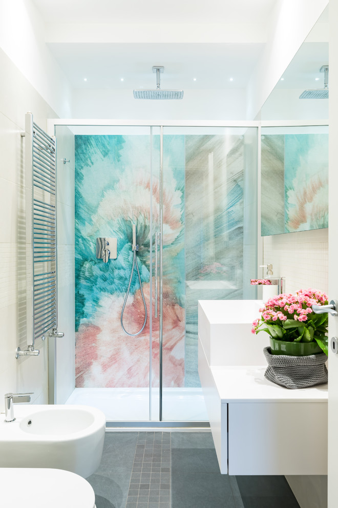 Trendy 3/4 beige tile and mosaic tile gray floor bathroom photo in Rome with white cabinets, white countertops, flat-panel cabinets, a bidet, white walls and a vessel sink