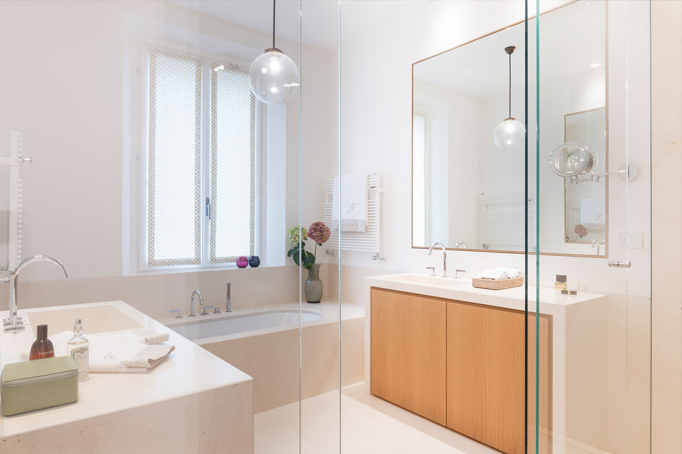 Inspiration for a contemporary ensuite bathroom in Other with flat-panel cabinets, medium wood cabinets, a submerged bath, beige tiles, white walls, an integrated sink, beige floors, an open shower and beige worktops.