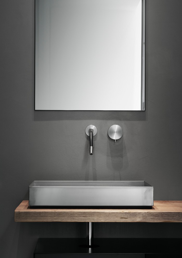 This is an example of a small contemporary shower room bathroom in Milan with open cabinets, a built-in shower, a two-piece toilet, grey walls, a trough sink and wooden worktops.