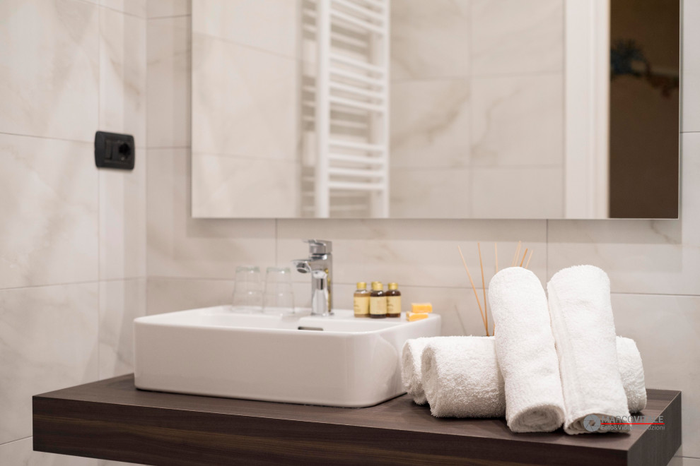 Design ideas for a large classic shower room bathroom in Other with brown cabinets, grey tiles, porcelain tiles, multi-coloured walls, terracotta flooring, a vessel sink, laminate worktops, orange floors, brown worktops, a single sink, a floating vanity unit and wallpapered walls.