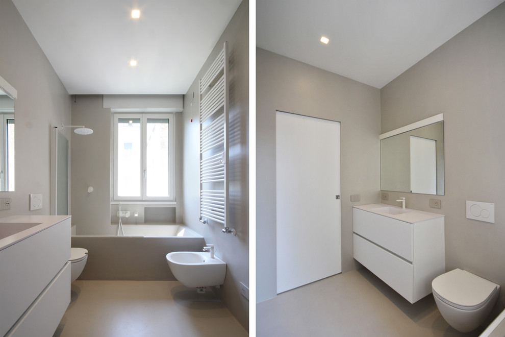 Design ideas for a large contemporary ensuite bathroom in Milan with recessed-panel cabinets, white cabinets, a japanese bath, a two-piece toilet, beige tiles, brown walls, concrete flooring, a trough sink, engineered stone worktops, beige floors and beige worktops.