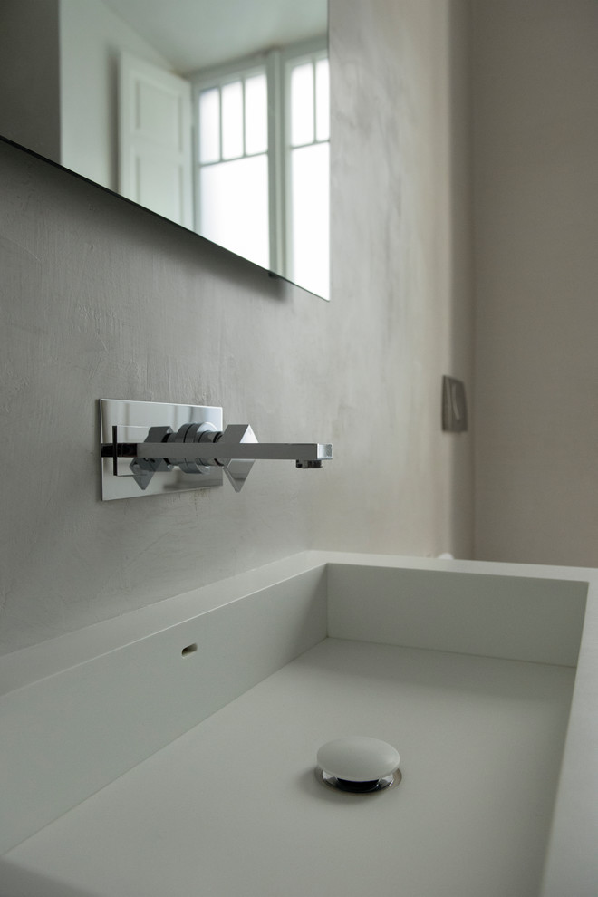 This is an example of a large contemporary shower room bathroom in Rome with open cabinets, grey walls, solid surface worktops and white worktops.