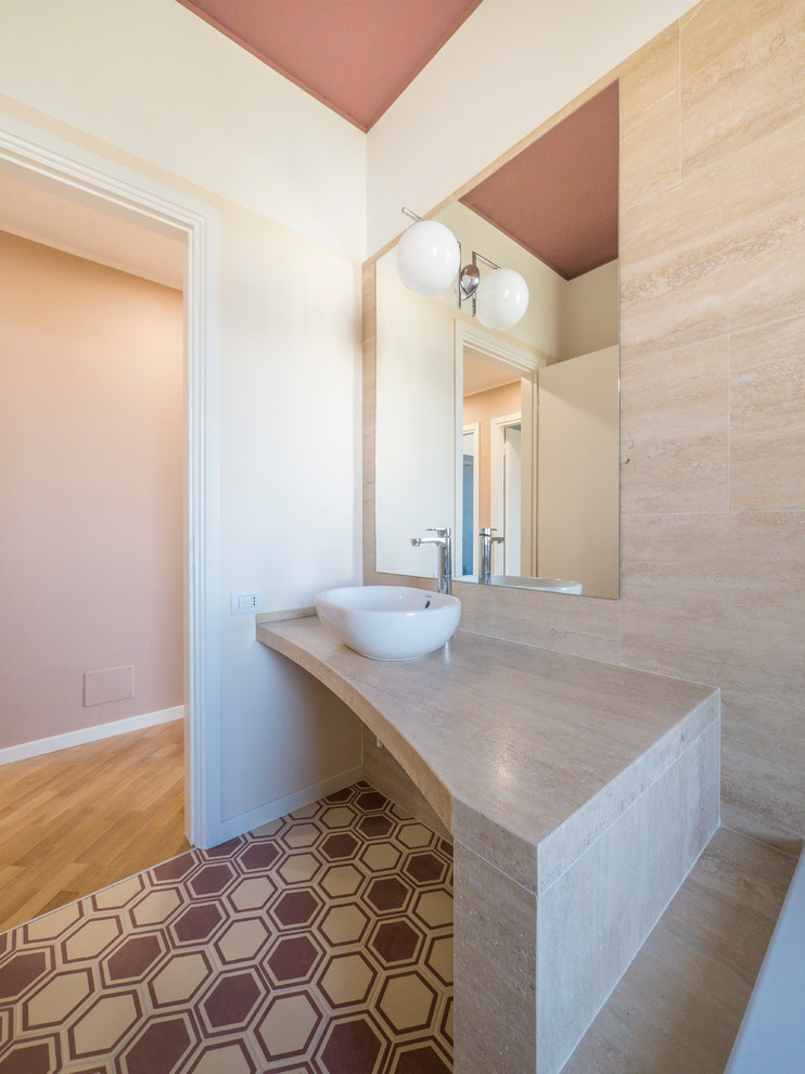 На фото: главная ванная комната среднего размера в стиле модернизм с плоскими фасадами, бежевыми фасадами, накладной ванной, душем над ванной, раздельным унитазом, разноцветной плиткой, керамогранитной плиткой, бежевыми стенами, полом из керамической плитки, настольной раковиной и мраморной столешницей с