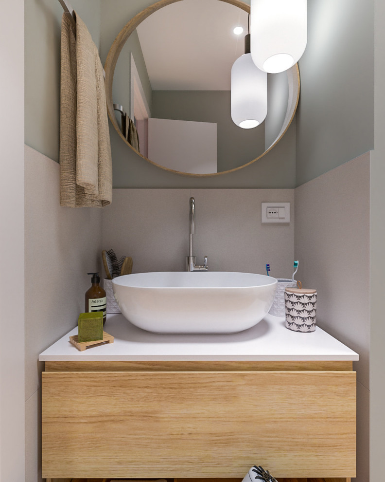 Photo of a small contemporary shower room bathroom in Milan with flat-panel cabinets, light wood cabinets, an alcove shower, a two-piece toilet, multi-coloured tiles, porcelain tiles, green walls, light hardwood flooring, a vessel sink, laminate worktops, a sliding door, white worktops, a single sink, a floating vanity unit and a drop ceiling.