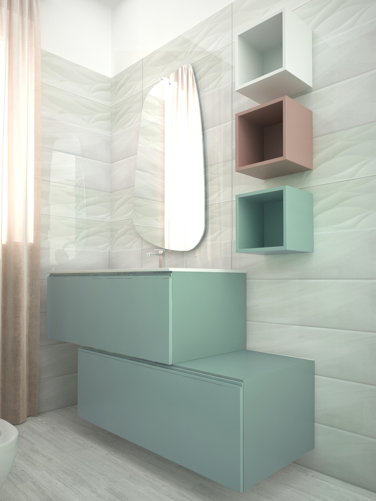 Design ideas for a small modern shower room bathroom in Other with flat-panel cabinets, a built-in shower, a wall mounted toilet, white tiles, ceramic tiles, white walls, porcelain flooring, an integrated sink, solid surface worktops, multi-coloured floors, a hinged door and white worktops.
