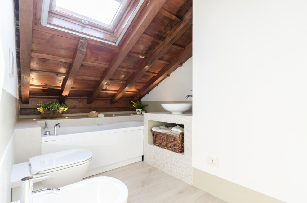 Small contemporary bathroom in Milan with beige tiles, porcelain tiles, white walls, wood-effect flooring, a vessel sink, tiled worktops, beige floors, beige worktops, exposed beams, a vaulted ceiling, a wood ceiling, a single sink, a hot tub and a two-piece toilet.