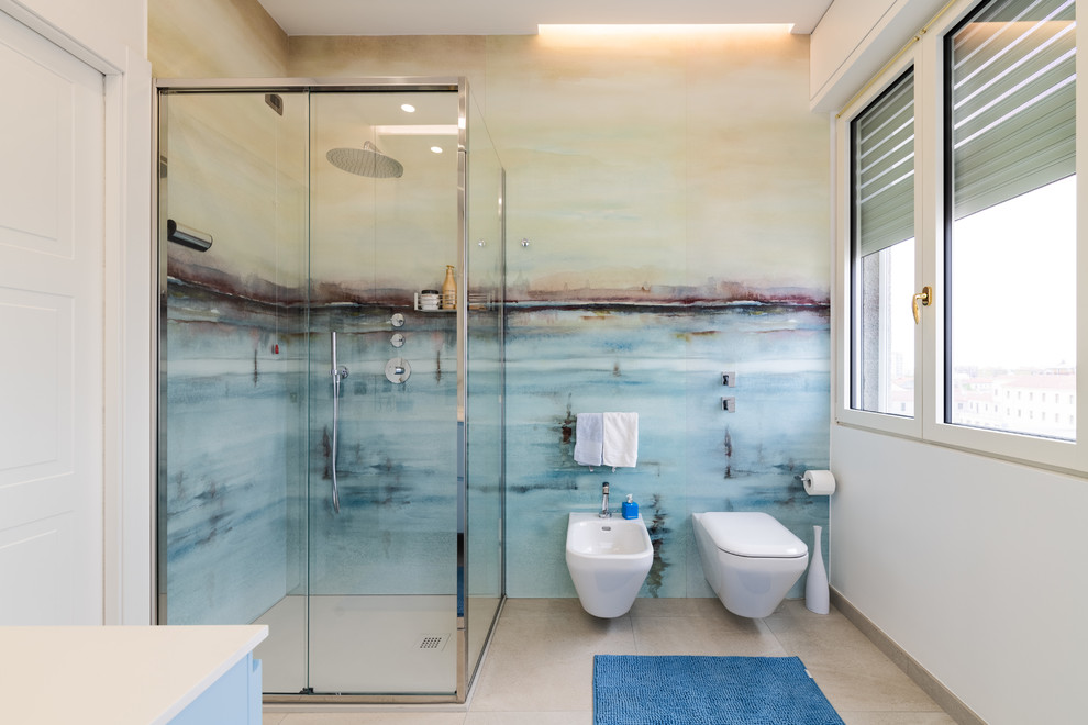 Example of a large trendy 3/4 multicolored tile and porcelain tile porcelain tile and gray floor bathroom design in Milan with turquoise cabinets, a two-piece toilet, white walls, an integrated sink, quartz countertops and white countertops