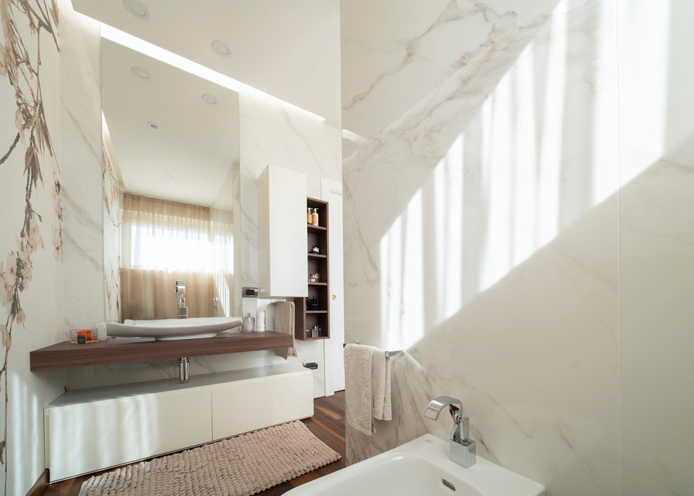 Design ideas for a large contemporary ensuite bathroom in Milan with open cabinets, brown cabinets, a hot tub, a built-in shower, a two-piece toilet, white tiles, porcelain tiles, white walls, dark hardwood flooring, a vessel sink, laminate worktops, brown floors, a sliding door and brown worktops.