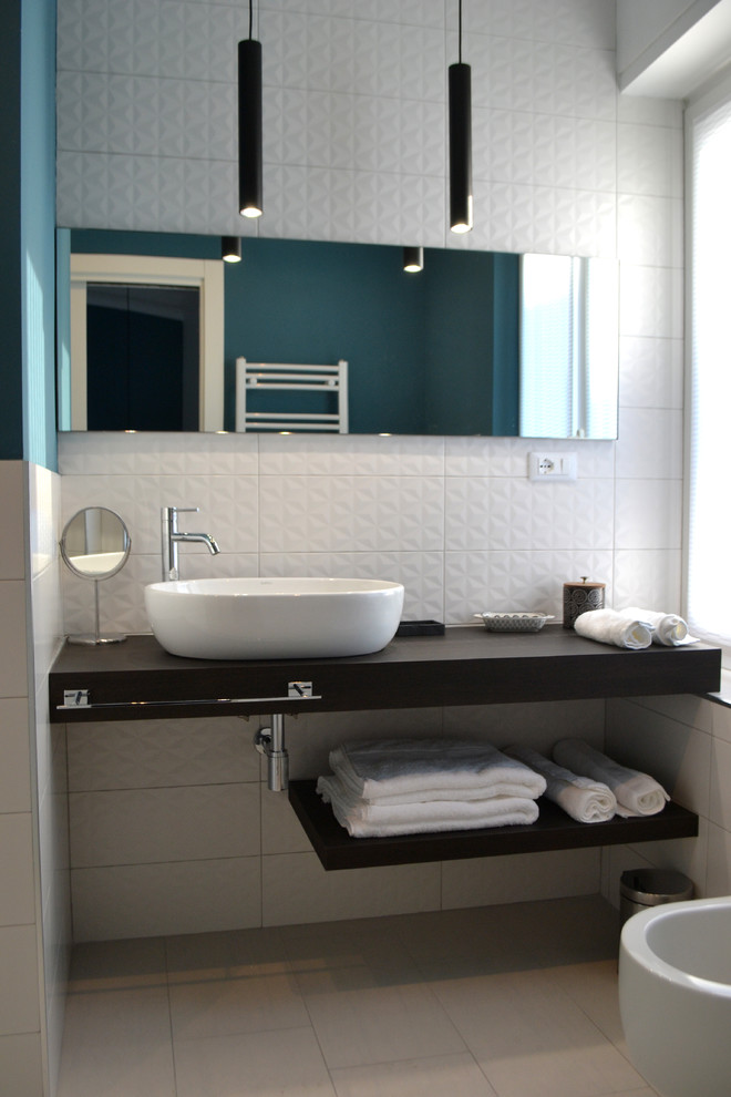 This is an example of a medium sized contemporary shower room bathroom in Other with open cabinets, dark wood cabinets, white tiles, porcelain tiles, blue walls, porcelain flooring, a vessel sink, laminate worktops and white floors.