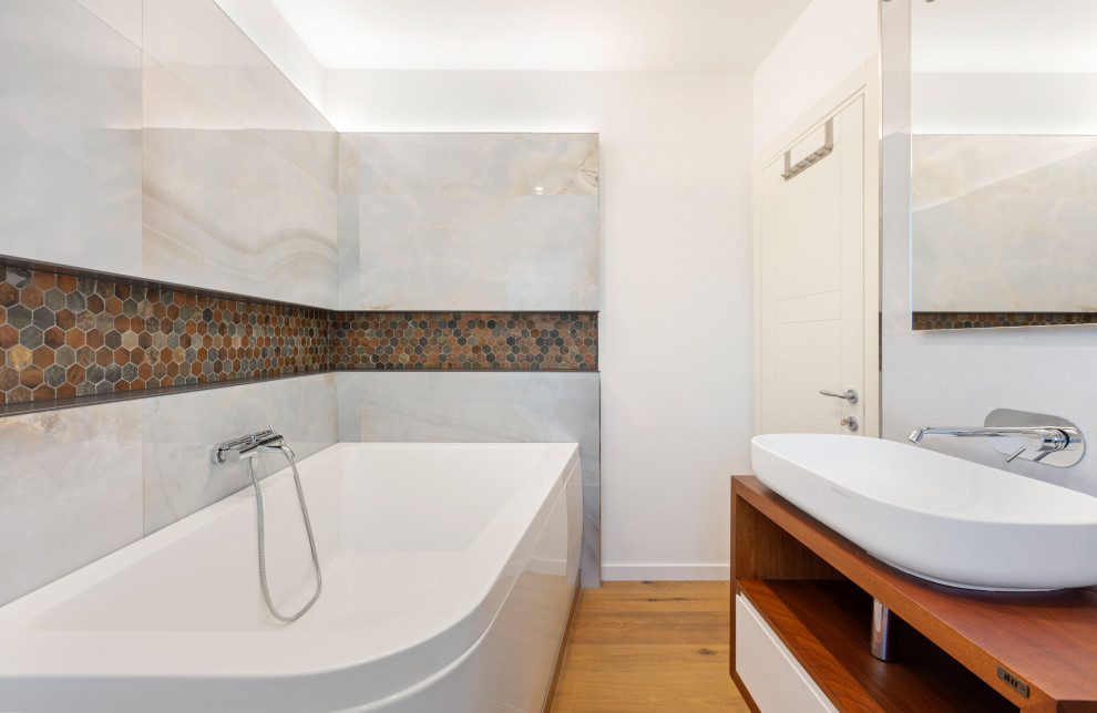 Example of a large trendy master brown tile and porcelain tile porcelain tile and brown floor corner bathtub design in Rome with open cabinets, brown cabinets, a wall-mount toilet, white walls, a vessel sink, wood countertops and brown countertops