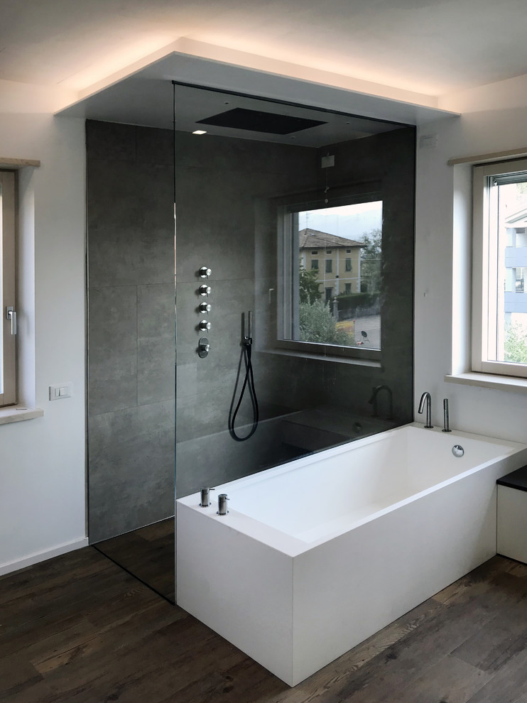 Inspiration for a large contemporary ensuite bathroom in Other with flat-panel cabinets, white cabinets, a freestanding bath, a walk-in shower, porcelain tiles, vinyl flooring, a vessel sink, engineered stone worktops, brown floors, an open shower and brown worktops.