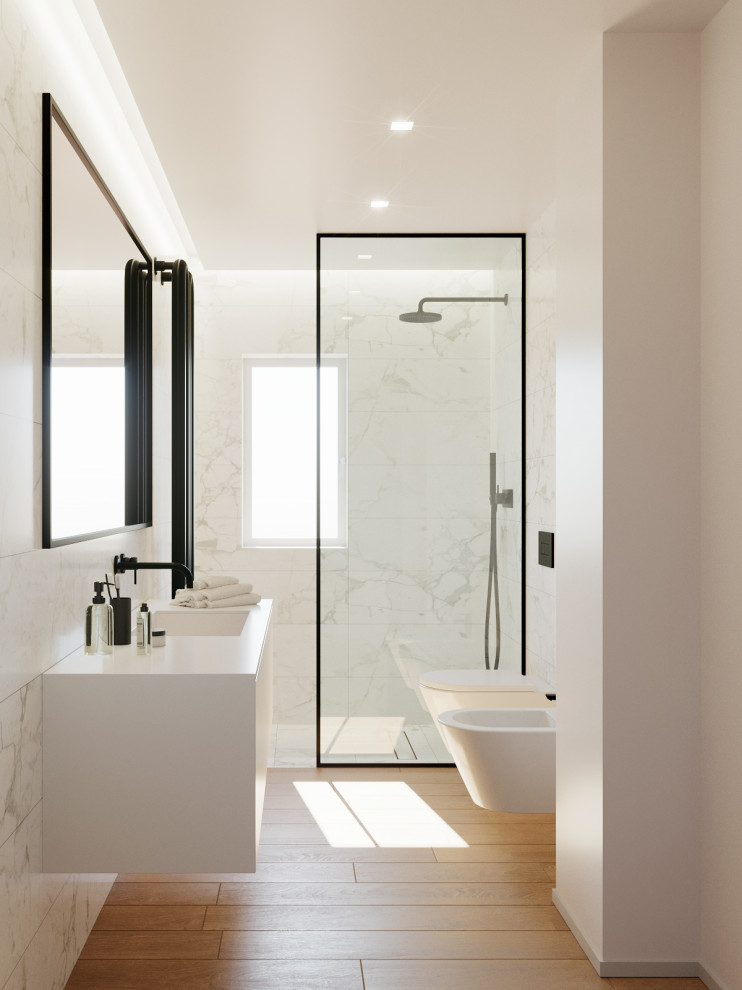 Idéer för mellanstora funkis vitt badrum med dusch, med luckor med profilerade fronter, vita skåp, en kantlös dusch, en bidé, svart och vit kakel, porslinskakel, klinkergolv i porslin, ett nedsänkt handfat, laminatbänkskiva och med dusch som är öppen