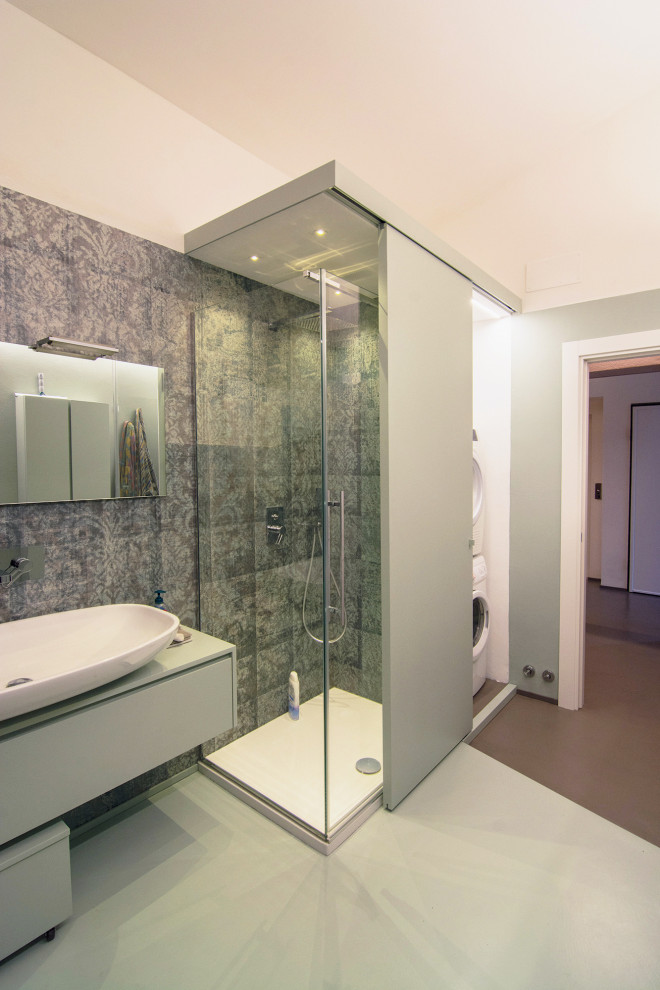 Bathroom - large contemporary 3/4 multicolored tile concrete floor, green floor, single-sink and wallpaper bathroom idea in Florence with flat-panel cabinets, green cabinets, a two-piece toilet, green walls, a vessel sink, wood countertops, turquoise countertops and a floating vanity