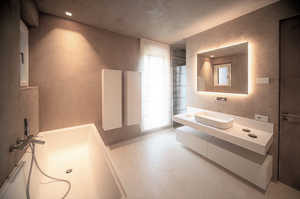 Large contemporary ensuite bathroom in Other with beaded cabinets, beige cabinets, an alcove shower, beige tiles, beige walls, marble flooring, a vessel sink, beige floors, a hinged door and white worktops.