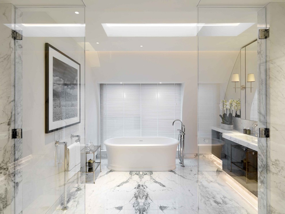 Design ideas for a contemporary bathroom in London with marble flooring, a built-in sink and white floors.