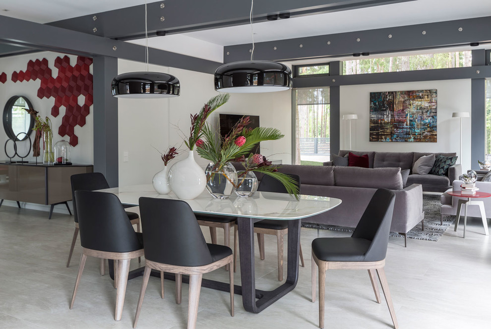 This is an example of a large contemporary dining room in Moscow with white walls, porcelain floors and beige floor.