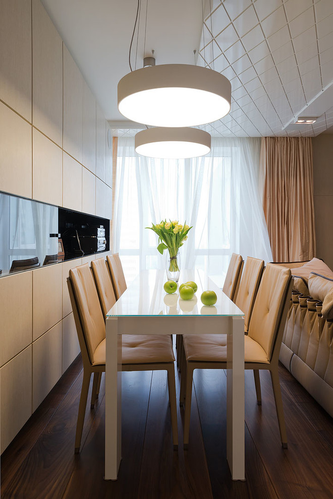 Photo of a small contemporary dining room in Moscow with beige walls and painted wood flooring.