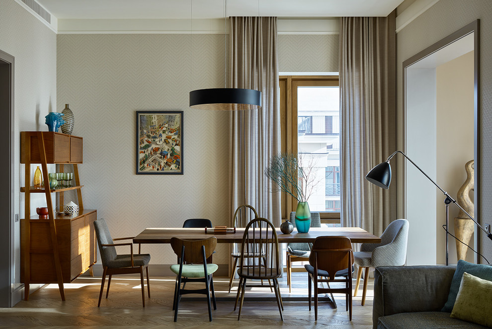 This is an example of a contemporary dining room in Moscow with grey walls, light hardwood flooring and beige floors.