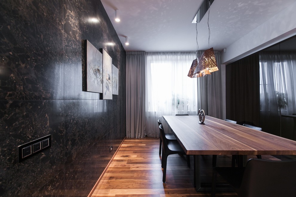 This is an example of a large contemporary open plan dining room in Saint Petersburg with black walls, medium hardwood flooring and brown floors.