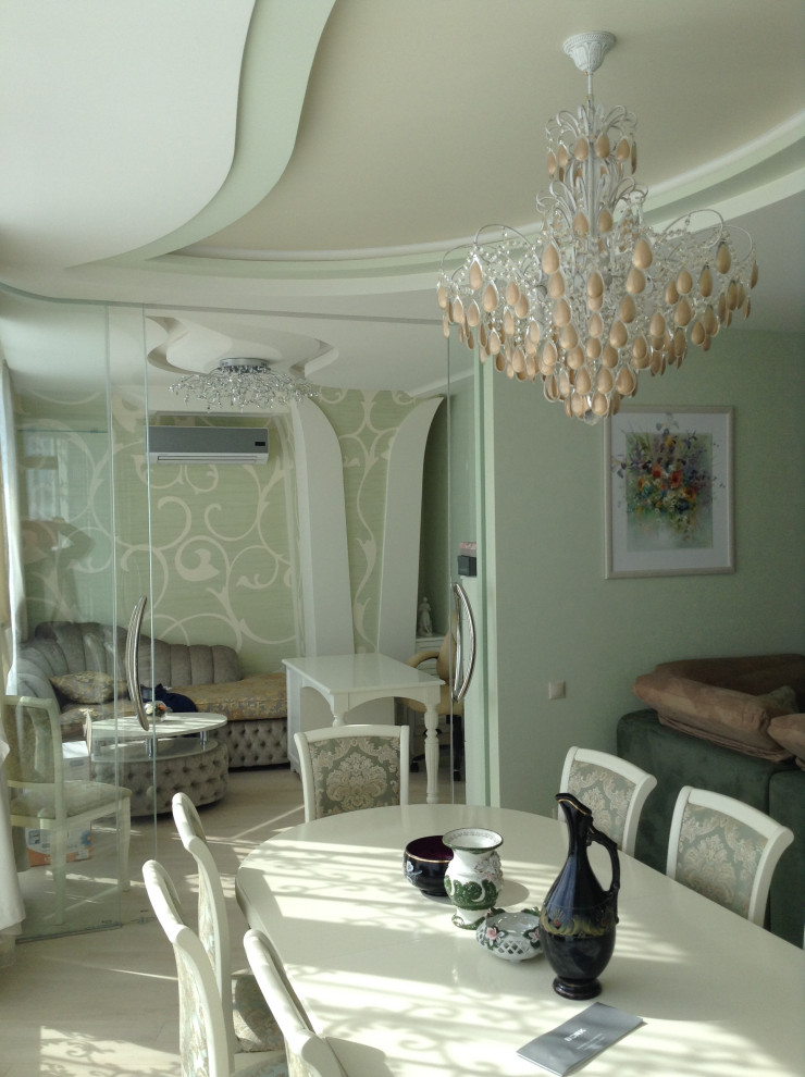 Example of a minimalist dining room design in Saint Petersburg