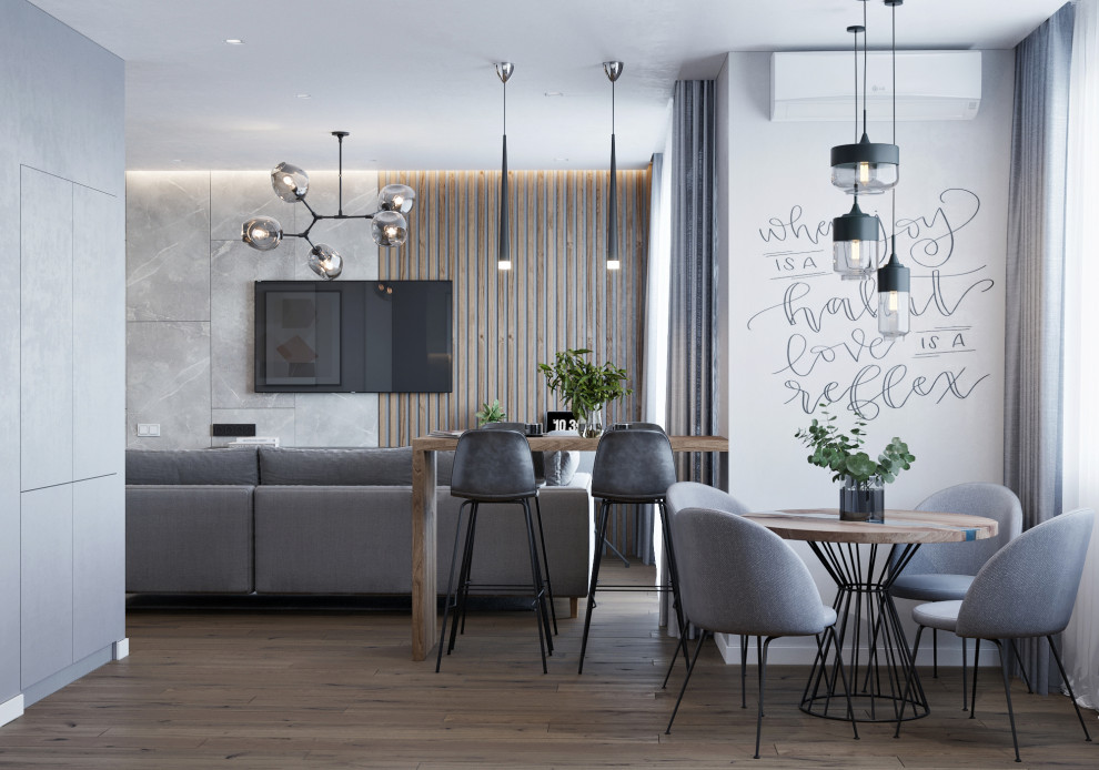 Mittelgroßes, Offenes Modernes Esszimmer mit grauer Wandfarbe, Laminat und braunem Boden in Sonstige