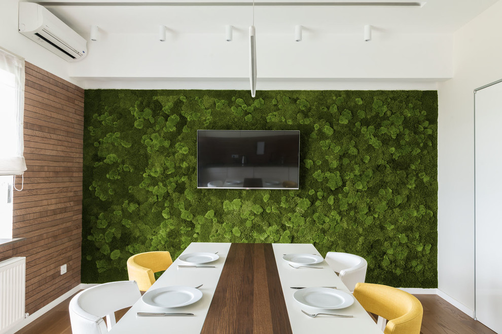 Cette photo montre une salle à manger ouverte sur la cuisine tendance avec un sol en linoléum, aucune cheminée et un mur vert.